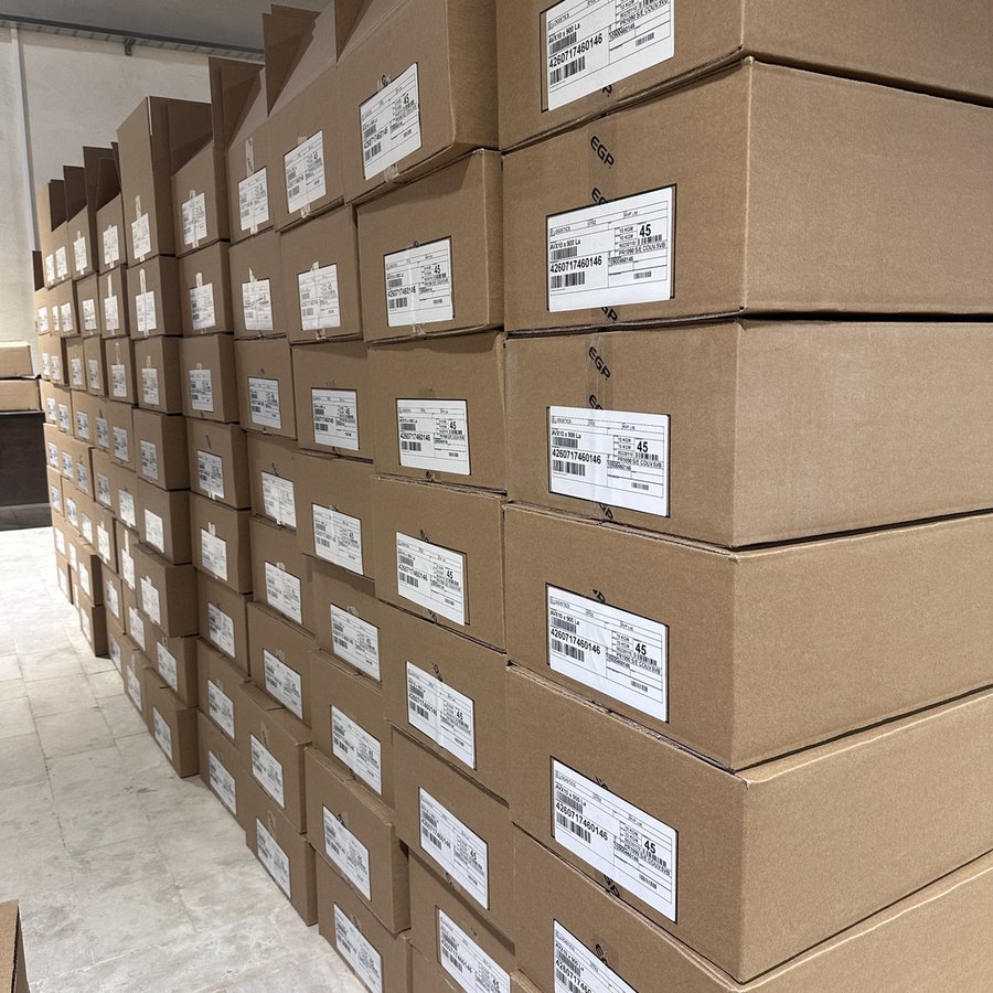 Warehouse stacked with EGP cartons